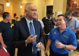 California State Senator Ed Hernandez chats with friend and fellow optometrist Jeff Garcia at a fundraiser Friday night. Hernandez is running for Lt. Governor.
